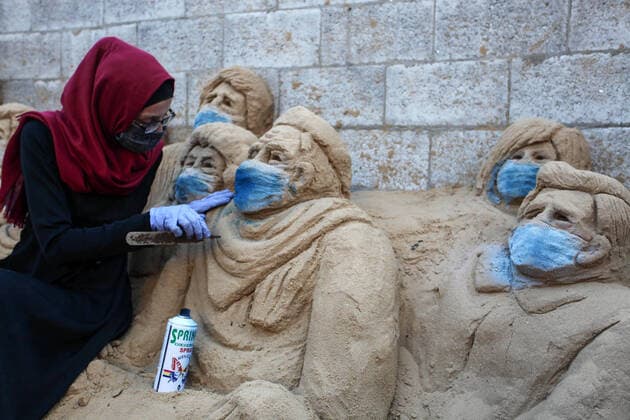 April 3, 2020, Gaza City, Gaza Strip, Palestinian Territory: A Palestinian artist Rana el-Ramlawi, 23, creates a sand sculpture stay home during awareness campaign about the spread of coronavirus disease (COVID-19), at her house Gaza city, on April 3, 2020. The United Nations has warned that a COVID-19 outbreak in Gaza could be disastrous, given the high poverty rates and weak health system in the coastal strip under Israeli blockade since 2007. Authorities in Gaza have said that more than 2,700 Palestinians are in home-isolation, mostly people who had returned from Egypt Gaza City Palestinian Territory - ZUMAap3_ 20200403_zaf_ap3_042 Copyright: xMahmoudxAjjourx