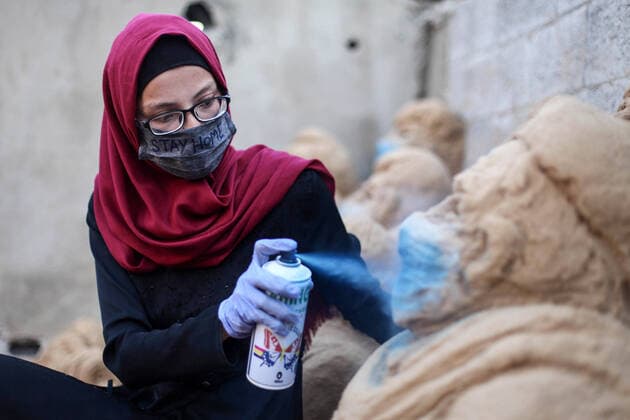 April 3, 2020, Gaza City, Gaza Strip, Palestinian Territory: A Palestinian artist Rana el-Ramlawi, 23, creates a sand sculpture stay home during awareness campaign about the spread of coronavirus disease (COVID-19), at her house Gaza city, on April 3, 2020. The United Nations has warned that a COVID-19 outbreak in Gaza could be disastrous, given the high poverty rates and weak health system in the coastal strip under Israeli blockade since 2007. Authorities in Gaza have said that more than 2,700 Palestinians are in home-isolation, mostly people who had returned from Egypt Gaza City Palestinian Territory - ZUMAap3_ 20200403_zaf_ap3_046 Copyright: xMahmoudxAjjourx