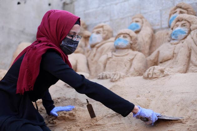 April 3, 2020, Gaza City, Gaza Strip, Palestinian Territory: A Palestinian artist Rana el-Ramlawi, 23, creates a sand sculpture stay home during awareness campaign about the spread of coronavirus disease (COVID-19), at her house Gaza city, on April 3, 2020. The United Nations has warned that a COVID-19 outbreak in Gaza could be disastrous, given the high poverty rates and weak health system in the coastal strip under Israeli blockade since 2007. Authorities in Gaza have said that more than 2,700 Palestinians are in home-isolation, mostly people who had returned from Egypt Gaza City Palestinian Territory - ZUMAap3_ 20200403_zaf_ap3_053 Copyright: xMahmoudxAjjourx