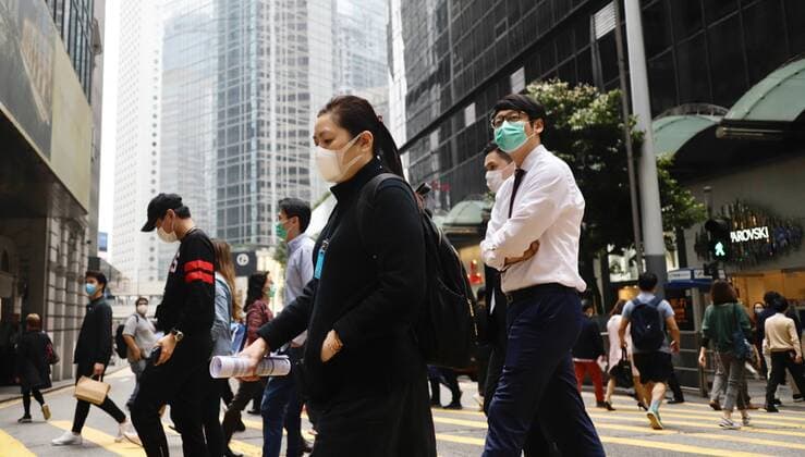 April 3, 2020, Hong Kong, CHINA: Masked White Collars crossing the road at the financial centre in CENTRAL. According to WHO,coronavirus infections introduced by China Pneumonia is almost reaching 1 million mark worldwide, continue to spread in alarming speed showing no sign of dissipation.April-3,2020 Hong Kong.ZUMA Hong Kong CHINA - ZUMAl137 20200403_zap_l137_001 Copyright: xLiauxChung-renx