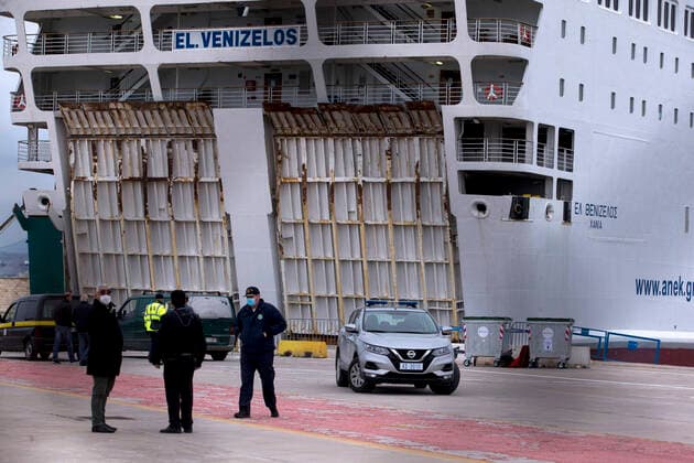 (200403) -- PIRAEUS, April 3, 2020 -- Members of the Greek Civil Protection and the Coast Guard are seen by the ferry Eleftherios Venizelos , in Piraeus, Greece, April 3, 2020. Greece reported on Thursday three more deaths linked to the novel coronavirus in the past 24 hours, bringing the total death toll to 53 since the first confirmed case in the country was announced on Feb. 26. ) GREECE-PIRAEUS-FERRY-INFECTION-COVID-19 MariosxLolos 