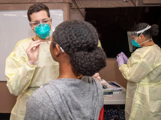 April 1, 2020, Apra Harbor, Guam, United States: U.S. Navy Hospital Corpsman 2nd Class Michael Lusk, takes a swab sample for COVID-19 testing aboard the aircraft carrier USS Theodore Roosevelt April 1, 2020 in Apra Harbor, Guam. The ships commanding officer Capt. Brett Crozier was relieved of duty March 31, 2020 after pleading to take action to help stem the spread of COVID-19 cases on his ship. Apra Harbor United States - ZUMAp138 20200401_zaa_p138_010 Copyright: xDartanonxDexLaxGarza Planetpixx