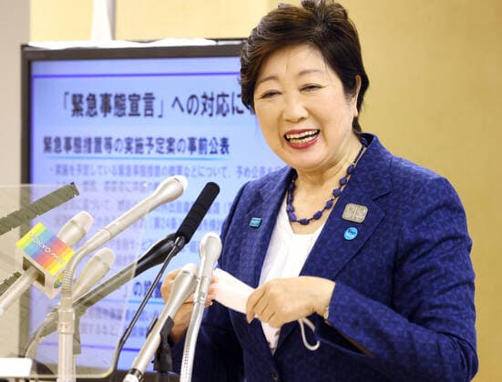 April 3, 2020, Tokyo, Japan - Tokyo Governor Yuriko Koike removes a face mask to drink water during a press conference at the Tokyo Metropolitan Government in Tokyo on Friday, April 3, 2020. Koike asked people to stay home over the weekend.  (125009372)