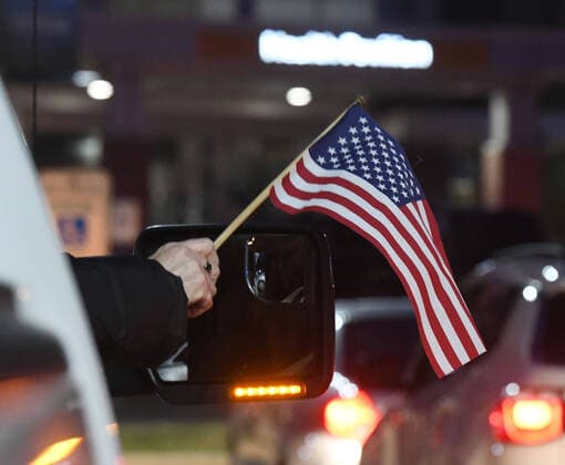 April 3, 2020, Racine, Wisconsin, USA: Hundreds of cars packed the campus of Ascension All Saints Hospital in Racine, Wisconsin Friday April 3, 2020 to show their support to the staff. The event, suggested by a NICU nurse, for cars to parade through the grounds flashing their headlights, was billed as Flashin First Friday because the traditional downtown First Fridays during which stores stay open late was canceled. So many cars came that the parade stalled that most cars just parked facing the hospital buildings and honked their horns for an hour. Racine County reported its first COVID-19 death Friday. Racine USA - ZUMAh154 20200403_znp_h154_027 Copyright: xMarkxHertzbergx