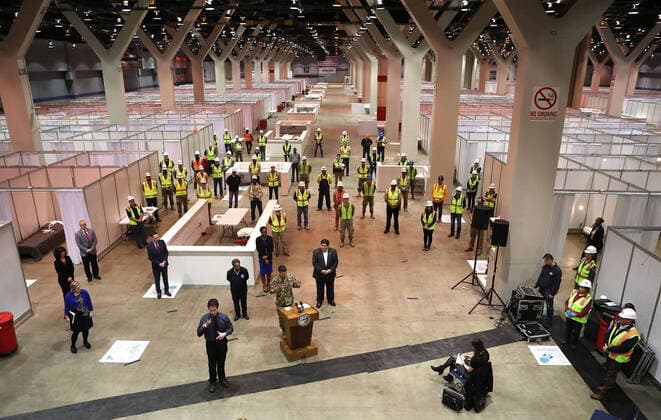 April 3, 2020, Chicago, IL, USA: Illinois Gov. J.B. Pritzker and Chicago Mayor Lori Lightfoot stand by during a news conference in Hall C Unit 1 of the COVID-19 alternate site at McCormick Place in Chicago on Friday, April 3, 2020. Hall C will house 500 beds. Chicago USA - ZUMAm67_ 20200403_zaf_m67_026 Copyright: xChrisxSwedax
