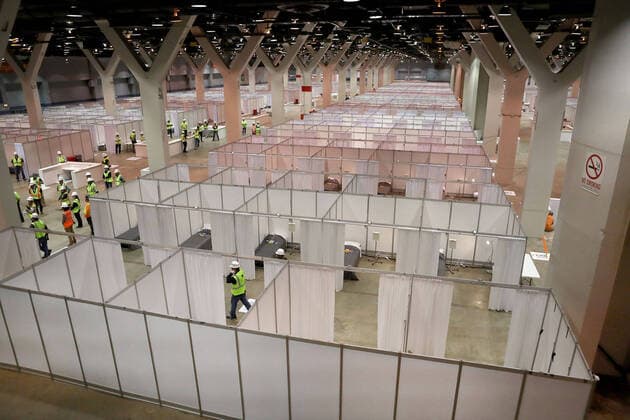 April 3, 2020, Chicago, Illinois, USA: Construction workers put the finishing touches on Hall C Unit 1 of the COVID-19 alternate site at McCormick Place in Chicago on Friday. Hall C will house 500 beds. Chicago USA - ZUMAm67_ 20200403_zaf_m67_038 Copyright: xChrisxSwedax