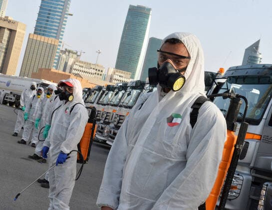 (200403) -- KUWAIT CITY, April 3, 2020 (Xinhua) -- Workers prepare to participate in a massive disinfection campaign in Kuwait City, Kuwait, on April 3, 2020. Kuwait reported on Friday 75 new COVID-19 cases, bringing the total number in the country to 417, the Health Ministry said in a statement. (Photo by Asad Xinhua) KUWAIT-KUWAIT CITY-COVID-19-DISINFECTION 