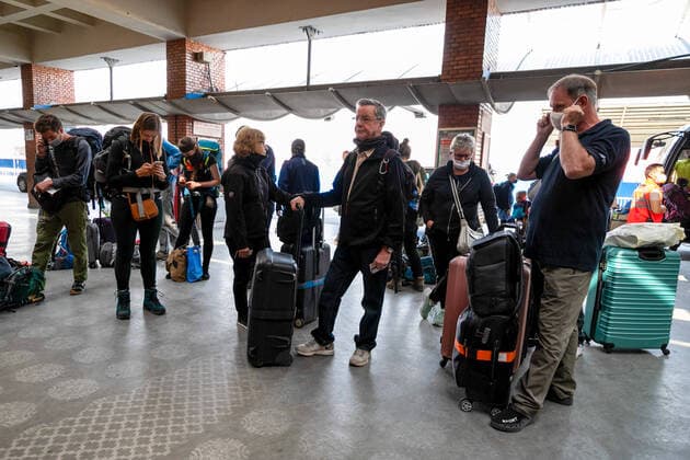 April 12, 2020, Kathmandu, Nepal: European tourists stranded while wearing protective masks as await for a flight back to home at Tribhuvan International Airport amid Coronavirus threat..European countries including Germany and France are taking back more than 600 citizens stranded in Nepal toady. Kathmandu Nepal - ZUMAs197 20200412_zaa_s197_001 Copyright: xPrabinxRanabhatx