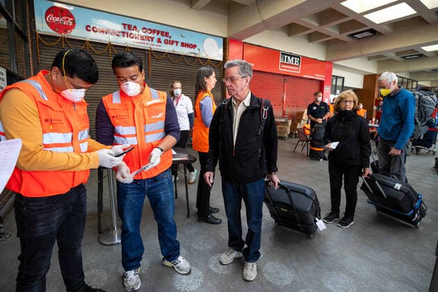 April 12, 2020, Kathmandu, Nepal: Staffs from German embassy check passenger s passport as await for a flight back to home at Tribhuvan International Airport amid Coronavirus threat..European countries including Germany and France are taking back more than 600 citizens stranded in Nepal toady. Kathmandu Nepal - ZUMAs197 20200412_zaa_s197_005 Copyright: xPrabinxRanabhatx