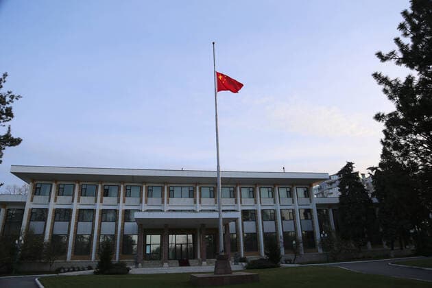 (200404) -- BUCHAREST, April 4, 2020 -- A Chinese national flag flies at half-mast to mourn for martyrs who died in the fight against the novel coronavirus disease (COVID-19) outbreak and compatriots who died of the disease at the Chinese Embassy to Romania in Bucharest, Romania, April 4, 2020. ) ROMANIA-BUCHAREST-COVID-19-CHINESE EMBASSY-NATIONAL FLAG-HALF-MAST ChenxJin 