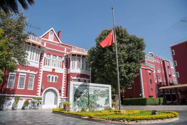 (200404) -- CAIRO, April 4, 2020 -- A Chinese national flag flies at half-mast to mourn for martyrs who died in the fight against the novel coronavirus disease (COVID-19) outbreak and compatriots who died of the disease at the Chinese Embassy to Egypt in Cairo, Egypt, April 4, 2020. ) EGYPT-CAIRO-COVID-19-CHINESE EMBASSY-NATIONAL FLAG-HALF-MAST WuxHuiwo 