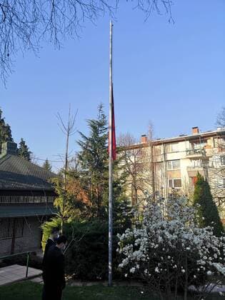 (200404) -- SARAJEVO, April 4, 2020 -- A Chinese national flag flies at half-mast to mourn for martyrs who died in the fight against the novel coronavirus disease (COVID-19) outbreak and compatriots who died of the disease at the Chinese Embassy to Bosnia and Herzegovina (BiH) in Sarajevo, BiH, April 4, 2020. (Chinese Embassy to Bosnia and Herzegovina Handout via Xinhua) BOSNIA AND HERZEGOVINA-SARAJEVO-COVID-19-CHINESE EMBASSY-NATIONAL FLAG-HALF-MAST ZhangxXiuzhi 
