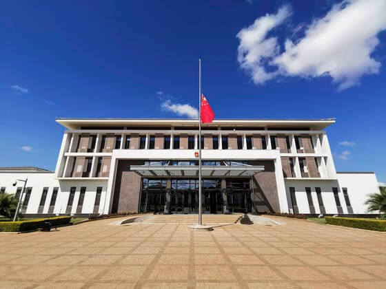 (200404) -- LILONGWE, April 4, 2020 (Xinhua) -- A Chinese national flag flies at half-mast to mourn for martyrs who died in the fight against the novel coronavirus disease (COVID-19) outbreak and compatriots who died of the disease at the Chinese Embassy to Malawi in Lilongwe, Malawi, April 4, 2020. (Photo by Liu Hongyang Xinhua) MALAWI-LILONGWE-COVID-19-CHINESE EMBASSY-NATIONAL FLAG-HALF-MAST 
