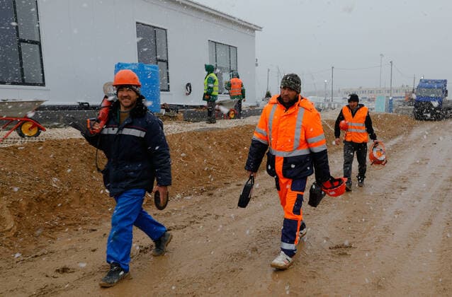 MOSCOW, RUSSIA - APRIL 4, 2020: Workers at the construction site of a new infectious deseases hospital for COVID-19 coronavirus patients by the village of Golokhvastovo. Mikhail Japaridze TASS  TS0D4689