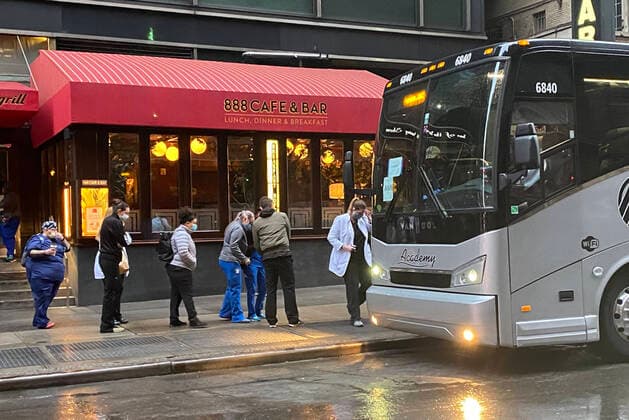 NEW YORK, NY- APRIL 4: Medical workers board a bus to their next hospital and care facility during the Coronavirus pandemic in New York City on April 4, 2020. Copyright: xRainmakerxPhotosx