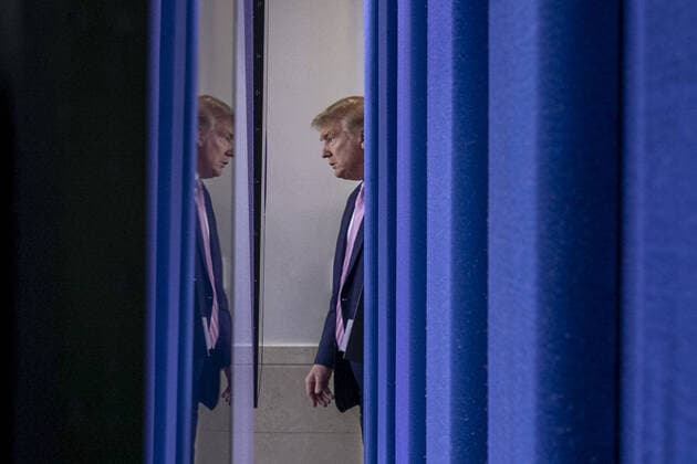 U.S. President Donald Trump arrives to speak at the coronavirus briefing at the White House Washington, D.C., U.S., on Saturday, April 4, 2020. New York s death toll from coronavirus on Saturday surpassed 3,500 as confirmed cases rose to 113,704, bringing the U.S. total to more than 7,700 fatalities and 287,000 cases. wax20200404117 TasosxKatopodis