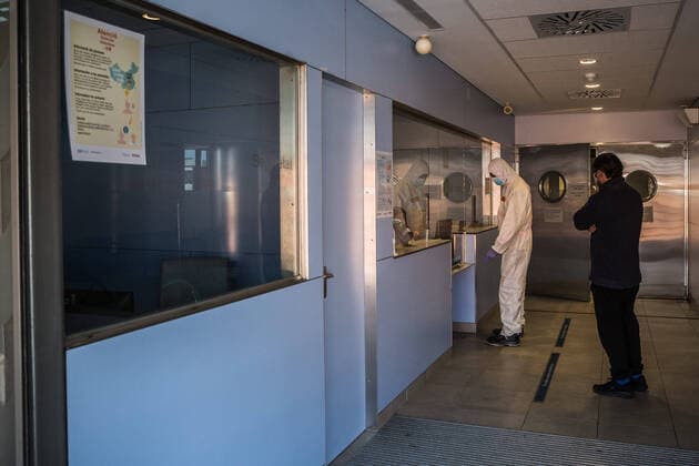 April 4, 2020, Girona, Spain: Emergency health worker in a protective gear as a preventive measure, finalising a transfer of a possible case of covid-19..The emergency health services are forced to comply with specific protocols during the transfers of patients with possible cases of covid-19. At the end of the service they disinfect and throw the personal protective equipment in G-II bags to avoid contagions. Girona Spain - ZUMAs197 20200404_zaa_s197_127 Copyright: xMartixNavarrox