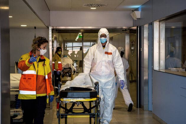 April 4, 2020, Girona, Spain: Emergency health workers in protective gear as a preventive measure, finalising a transfer of a possible case of covid-19..The emergency health services are forced to comply with specific protocols during the transfers of patients with possible cases of covid-19. At the end of the service they disinfect and throw the personal protective equipment in G-II bags to avoid contagions. Girona Spain - ZUMAs197 20200404_zaa_s197_140 Copyright: xMartixNavarrox