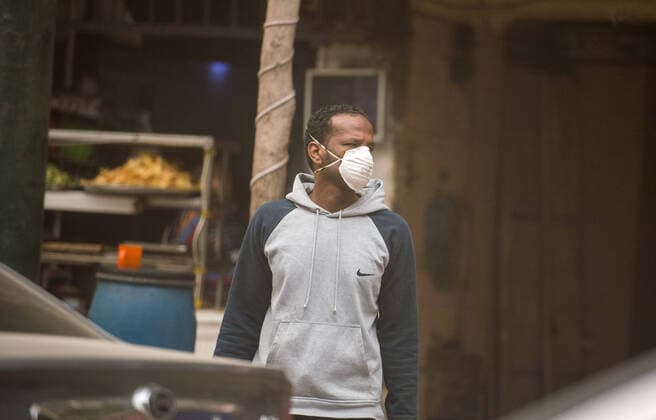 (200405) -- CAIRO, April 5, 2020 -- A pedestrian wearing a mask walks on a street in Cairo, Egypt, April 5, 2020. Egypt on Saturday reported five new deaths from the COVID-19 infection, bringing the pandemic fatalities in the country to 71. ) EGYPT-CAIRO-COVID-19-DAILY LIFE WuxHuiwo 