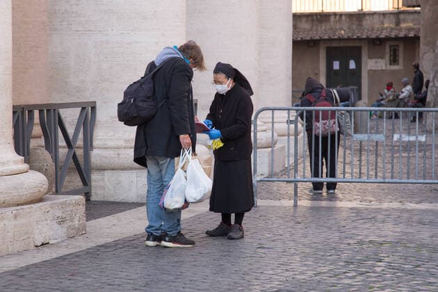 Palm Sunday in St. Peter s Square during CoVID-19 Palm Sunday in St. Peter s Square in Rome in this lockdown period due to the Covid-19 pandemic Roma Italy Copyright: MatteoxNardone