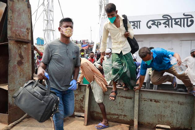 April 5, 2020, Mawa, Dhaka, Bangladesh: Thousands of readymade garment workers from across the country had either walked or used alternative modes of transpiration to reach capital Dhaka over the past few days, as owners decided to open the factories amid a government-enforced soft shutdown to prevent the novel coronavirus from spreading further. But following harsh criticisms, BGMEA was forced to keep the factories closed until April 11. The workers were told to go back home when they went to the factories to join work on Sunday morning. These photoss of people returning to their village homes were taken at the Shimulia ferry terminal in Mawa, near Dhaka, Bangladesh, April 05, 2020. Mawa Bangladesh - ZUMAd117 20200405_zap_d117_001 Copyright: xSuvraxKantixDasx
