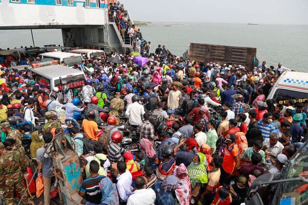 April 5, 2020, Mawa, Dhaka, Bangladesh: Thousands of readymade garment workers from across the country had either walked or used alternative modes of transpiration to reach capital Dhaka over the past few days, as owners decided to open the factories amid a government-enforced soft shutdown to prevent the novel coronavirus from spreading further. But following harsh criticisms, BGMEA was forced to keep the factories closed until April 11. The workers were told to go back home when they went to the factories to join work on Sunday morning. These photoss of people returning to their village homes were taken at the Shimulia ferry terminal in Mawa, near Dhaka, Bangladesh, April 05, 2020. Mawa Bangladesh - ZUMAd117 20200405_zap_d117_024 Copyright: xSuvraxKantixDasx