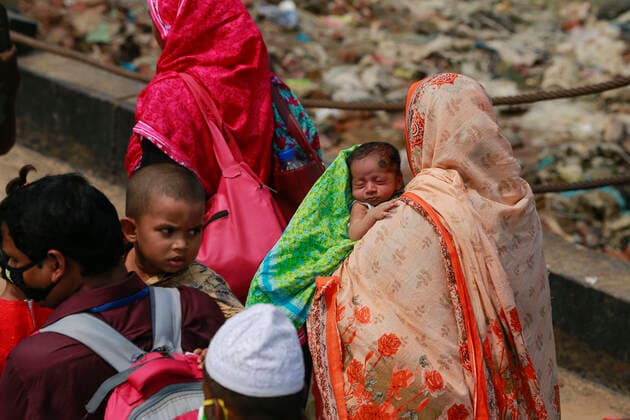 April 5, 2020, Mawa, Dhaka, Bangladesh: Thousands of readymade garment workers from across the country had either walked or used alternative modes of transpiration to reach capital Dhaka over the past few days, as owners decided to open the factories amid a government-enforced soft shutdown to prevent the novel coronavirus from spreading further. But following harsh criticisms, BGMEA was forced to keep the factories closed until April 11. The workers were told to go back home when they went to the factories to join work on Sunday morning. These photoss of people returning to their village homes were taken at the Shimulia ferry terminal in Mawa, near Dhaka, Bangladesh, April 05, 2020. Mawa Bangladesh - ZUMAd117 20200405_zap_d117_041 Copyright: xSuvraxKantixDasx