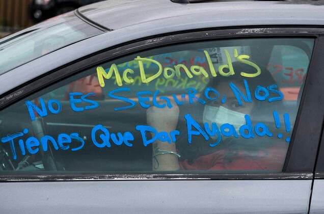 April 5, 2020, Los Angeles, California, U.S: A worker wearing a face mask takes part in a drive-thru strike at a McDonald s restaurant on Sunday, April 5, 2020 in Los Angeles. The workers are demanding a two-week quarantine period, with full pay for a co-worker who tested positive for COVID-19. Los Angeles U.S. - ZUMAc68_ 20200405_zaf_c68_004 Copyright: xRingoxChiux