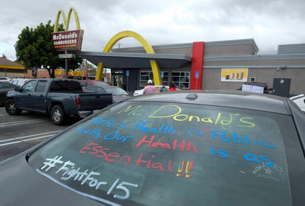 April 5, 2020, Los Angeles, California, U.S: Workers take part in a drive-thru strike at a McDonald s restaurant on Sunday, April 5, 2020 in Los Angeles. The workers are demanding a two-week quarantine period, with full pay for a co-worker who tested positive for COVID-19. Los Angeles U.S. - ZUMAc68_ 20200405_zaf_c68_011 Copyright: xRingoxChiux