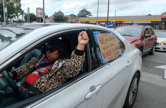 April 5, 2020, Los Angeles, California, U.S: A worker takes part in a drive-thru strike at a McDonald s restaurant on Sunday, April 5, 2020 in Los Angeles. The workers are demanding a two-week quarantine period, with full pay for a co-worker who tested positive for COVID-19. Los Angeles U.S. - ZUMAc68_ 20200405_zaf_c68_016 Copyright: xRingoxChiux