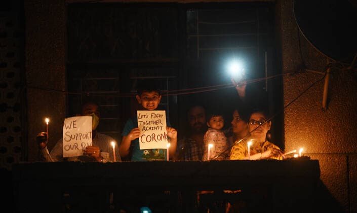NEW DELHI, INDIA APRIL 5: People s homes lit up with candles and earthen lamps (diyas) in a show of solidarity and support for frontline workers, on day twelve of the nationwide lockdown to combat coronavirus, at Gold Links Dwarka, on April 5, 2020 in New Delhi, India. Millions of Indians across the country switched off lights at their homes and lit candles and diyas or turned on mobile phone torches on Sunday night, responding to Prime Minister Narendra Modi s appeal to show the nation s collective resolve and solidarity in its fight against coronavirus with this symbolic gesture. (Photo by Vipin Kumar Hindustan Times ) Millions Of Indians Light Candles, Diyas, Turn On Mobile Phone Torches After Prime Minister Modi?s Appeal