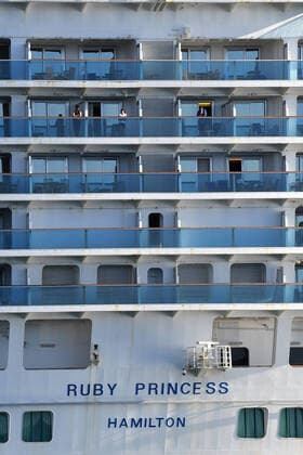 RUBY PRINCESS COVID-19 EVACUATIONS, Crew on board the Ruby Princess as the cruise liner docks at Port Kembla, Wollongong, Monday, April 6, 2020. A criminal investigation will be launched into how cruise line operator Carnival Australia was allowed to disembark Ruby Princess passengers in Sydney, resulting in several deaths and COVID-19 outbreaks throughout the country. ( NO ARCHIVING, EDITORIAL USE ONLY, NO USE IN BOOKS WITHOUT CONSENT SYDNEY NSW AUSTRALIA  Copyright: xDEANxLEWINSx 20200406001461954796