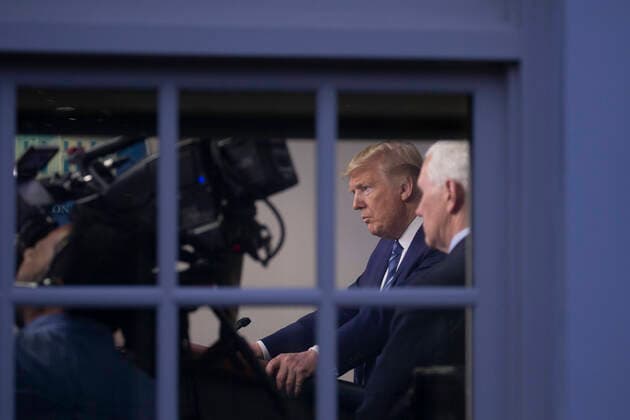 United States Vice President Mike Pence listens to US President Donald J. Trump speak at the coronavirus briefing at the White House Washington, D.C., U.S., on Sunday, April 5, 2020. The next two weeks will be crucial in the United States fight against the coronavirus, warn health officials, who are urging Americans to continue practicing social-distancing measures. Copyright: xTasosxKatopodisx