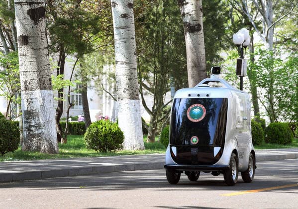 (200406) -- BEIJING, April 6, 2020 -- A 5G unmanned delivery car delivers goods at the Beijing Institute of Technology in Beijing, capital of China, April 6, 2020. A 5G unmanned delivery car was put into use at the Beijing Institute of Technology, which can measure the temperature of people entering the campus, recognise facial information, and also can conduct no-touch delivery. ) CHINA-BEIJING-CAMPUS-UNMANNED DELIVERY CAR (CN) RenxChao 