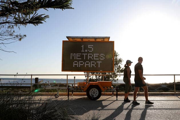 AUSTRALIA CORONAVIRUS COVID-19, Members of the public are seen walking past a sign reading 1.5 Metres Apart at Scarborough Beach, Perth, Monday, April 6, 2020. Beaches in Perth remain open but people must still adhere to social distancing rules. ( NO ARCHIVING, EDITORIAL USE ONLY, NO USE IN BOOKS WITHOUT CONSENT PERTH WA AUSTRALIA  Copyright: xRICHARDxWAINWRIGHTx 20200406001462004884