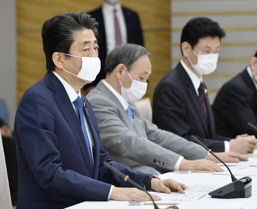New coronavirus Japanese Prime Minister Shinzo Abe (L) attends a meeting of the government s coronavirus task force on April 6, 2020, in Tokyo. 