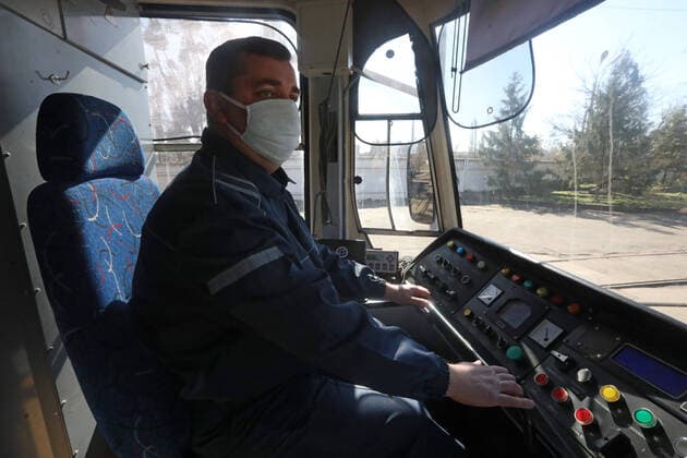 KYIV, UKRAINE - APRIL 06, 2020 - Tram driver in a medical mask is pictured in the cabin, Kyiv, capital of Ukraine. Medical examination for public transport drivers conducted in Kyiv  Copyright: xYuliiaxOvsyannikovax