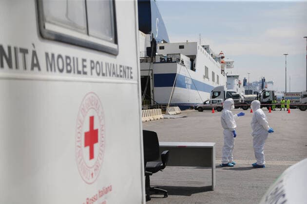Paramedics wait to check the passengers of the Catania Grimaldi ferry that brought at home 105 Italians citizens evaquated from Tuinisia.In Italy the lockdown still continue Government Decree declaring all of Italy a protected area to combat covid-19 - coronavirus infection, closing schools, public offices and shops.  Copyright: xCarloxHermannx xIPAx xKontrolabx