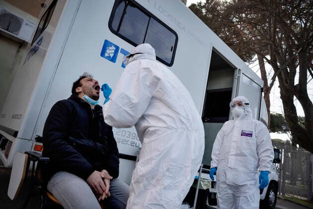 April 6, 2020, Roma, Roma, Italy: The collection of swab samples by medical staff in a drive-in testing center in Roma to check the Coronavirus (Covid-19).Health workers are dressing with protective suits..The Italian Government is still adopting the measure of a national lockout by closing all activities, except for essential services in an attempt to fight Coronavirus (COVID-19) .All the city, as all the whole country, is under quarantine and the movement are restricted to the necessary. Roma Italy - ZUMAt147 20200406_zip_t147_016 Copyright: xMatteoxTrevisanx