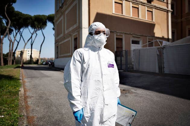 April 6, 2020, Roma, Roma, Italy: The collection of swab samples by medical staff in a drive-in testing center in Roma to check the Coronavirus (Covid-19).Health workers are dressing with protective suits..The Italian Government is still adopting the measure of a national lockout by closing all activities, except for essential services in an attempt to fight Coronavirus (COVID-19) .All the city, as all the whole country, is under quarantine and the movement are restricted to the necessary. Roma Italy - ZUMAt147 20200406_zip_t147_020 Copyright: xMatteoxTrevisanx