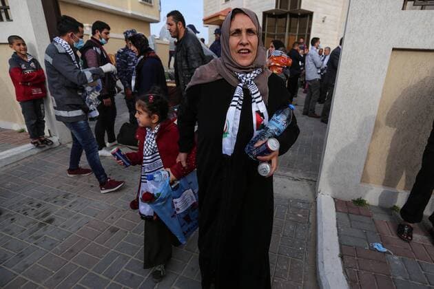 April 6, 2020, Khan Younis, Gaza Strip, Palestinian Territory: Palestinians who were quarantined leave the quarantine centers, after the end of the quarantine period in the center of Muscat in Khan Younis in the southern of Gaza strip, April 6, 2020 Khan Younis Palestinian Territory - ZUMAap3_ 20200406_zaf_ap3_083 Copyright: xAshrafxAmrax