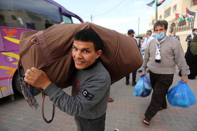April 6, 2020, Khan Younis, Gaza Strip, Palestinian Territory: Palestinians who were quarantined leave the quarantine centers, after the end of the quarantine period in the center of Muscat in Khan Younis in the southern of Gaza strip, April 6, 2020 Khan Younis Palestinian Territory - ZUMAap3_ 20200406_zaf_ap3_111 Copyright: xAshrafxAmrax