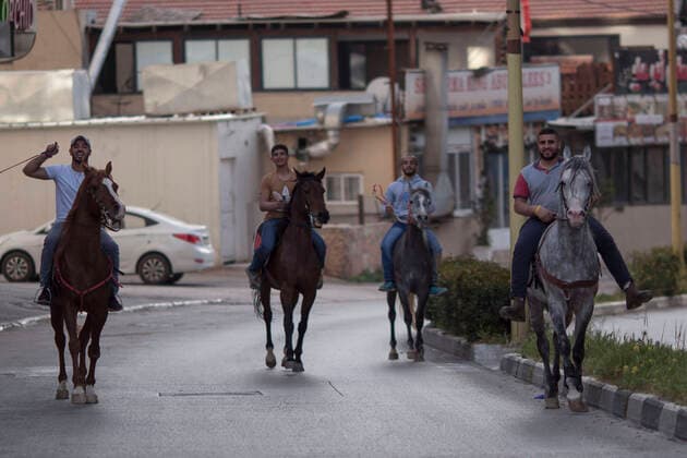 April 6, 2020, Bethlehem, West Bank: Palestinian ride their horses in the alost-empty streets of Bethlehem during the closure for more than a month. Bethlehem West Bank - ZUMAb133 20200406_zap_b133_002 Copyright: xMustafaxBaderx