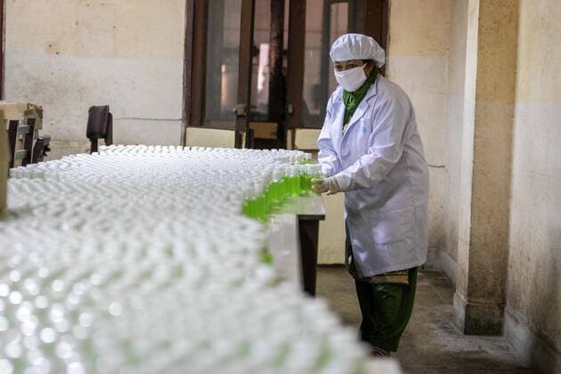 April 14, 2020, Kathmandu, Nepal: A worker arranges plastic bottles of hand sanitizer at Nepal Ausadi Limited during the fourteenth day of the nationwide lockdown amid concerns about the spread of corona virus (COVID-19) in Kathmandu..The coronavirus outbreak has made the Indian government to restrict the export of dozens of drugs, including paracetamol leading to fears of a global shortage of essential medicines. Kathmandu Nepal - ZUMAs197 20200414_zaa_s197_003 Copyright: xPrabinxRanabhatx