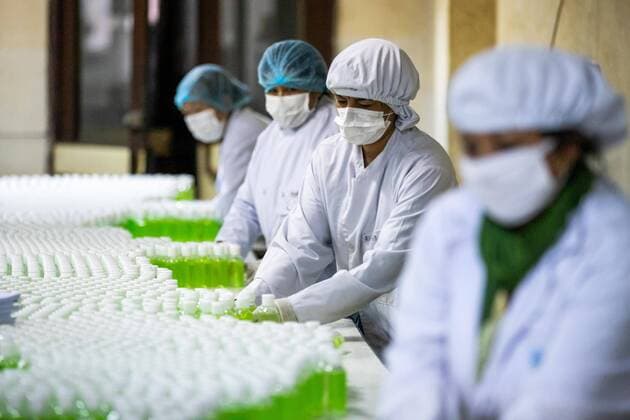 April 14, 2020, Kathmandu, Nepal: Workers label and arrange plastic bottles of hand sanitizer at Nepal Ausadi Limited during the fourteenth day of the nationwide lockdown amid concerns about the spread of corona virus (COVID-19) in Kathmandu..The coronavirus outbreak has made the Indian government to restrict the export of dozens of drugs, including paracetamol leading to fears of a global shortage of essential medicines. Kathmandu Nepal - ZUMAs197 20200414_zaa_s197_005 Copyright: xPrabinxRanabhatx