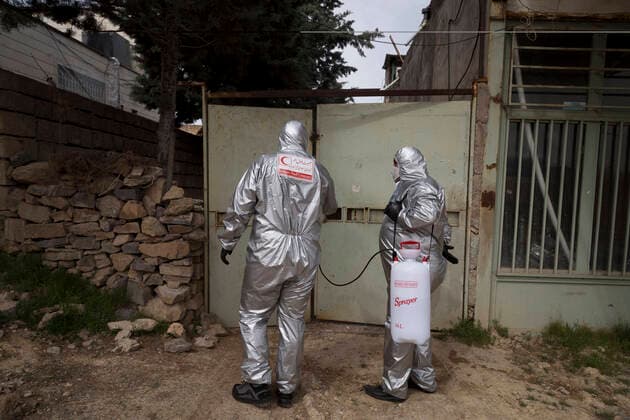 April 6, 2020, Tehran, Iran: Members of the Iranian Red Crescent s Volunteers Organization wearing face masks and protective suit attend the Hameh Sin (Torkaman) mountain village for sanitizing and screening villagers who may be infected by the novel coronavirus (COVID-19) disease in eastern Tehran, Iran. Media reported that Iran is one of the most affected by pandemic COVID-19 disease caused by the SARS-CoV-2 coronavirus. According to the latest reports by the Iranian Ministry of Health, over 3,700 people have died from the coronavirus infection throughout the country. Tehran Iran - ZUMAf146 20200406_zip_f146_047 Copyright: xRouzbehxFouladix