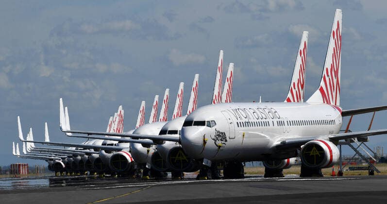 AUSTRALIA CORONAVIRUS COVID-19, Grounded Virgin Australia aircraft are seen parked at Brisbane Airport in Brisbane, Tuesday, April 7, 2020. Brisbane Airport Corporation (BAC) is working with airlines by accommodating up to 100 grounded aircraft free of charge in response to government-mandated travel restrictions that have grounded a significant proportion of Australia s airline fleet because of the Coronavirus (COVID-19). ( NO ARCHIVING, EDITORIAL USE ONLY, NO USE IN BOOKS WITHOUT CONSENT BRISBANE QLD AUSTRALIA  Copyright: xDARRENxENGLANDx 20200407001462125984