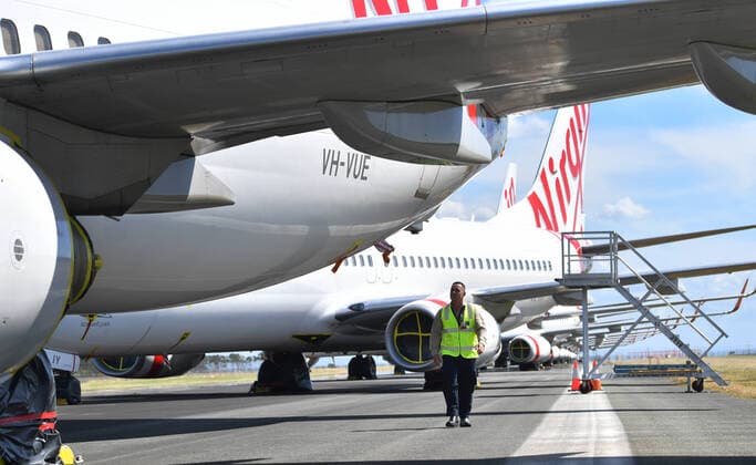 AUSTRALIA CORONAVIRUS COVID-19, Airside operations team leader Chris McCullen is seen with grounded Virgin Australia aircraft at Brisbane Airport in Brisbane, Tuesday, April 7, 2020. Brisbane Airport Corporation (BAC) is working with airlines by accommodating up to 100 grounded aircraft free of charge in response to government-mandated travel restrictions that have grounded a significant proportion of Australia s airline fleet because of the Coronavirus (COVID-19). ( NO ARCHIVING, EDITORIAL USE ONLY, NO USE IN BOOKS WITHOUT CONSENT BRISBANE QLD AUSTRALIA  Copyright: xDARRENxENGLANDx 20200407001462126694