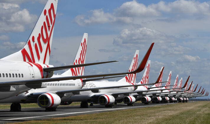 AUSTRALIA CORONAVIRUS COVID-19, Grounded Virgin Australia aircraft are seen parked at Brisbane Airport in Brisbane, Tuesday, April 7, 2020. Brisbane Airport Corporation (BAC) is working with airlines by accommodating up to 100 grounded aircraft free of charge in response to government-mandated travel restrictions that have grounded a significant proportion of Australia s airline fleet because of the Coronavirus (COVID-19). ( NO ARCHIVING, EDITORIAL USE ONLY, NO USE IN BOOKS WITHOUT CONSENT BRISBANE QLD AUSTRALIA  Copyright: xDARRENxENGLANDx 20200407001462127707