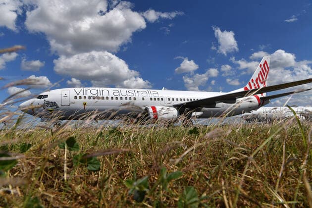 AUSTRALIA CORONAVIRUS COVID-19, Grounded Virgin Australia aircraft are seen parked at Brisbane Airport in Brisbane, Tuesday, April 7, 2020. Brisbane Airport Corporation (BAC) is working with airlines by accommodating up to 100 grounded aircraft free of charge in response to government-mandated travel restrictions that have grounded a significant proportion of Australia s airline fleet because of the Coronavirus (COVID-19). ( NO ARCHIVING, EDITORIAL USE ONLY, NO USE IN BOOKS WITHOUT CONSENT BRISBANE QLD AUSTRALIA  Copyright: xDARRENxENGLANDx 20200407001462127895